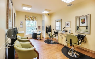 Hair salon interior with styling chairs and equipment