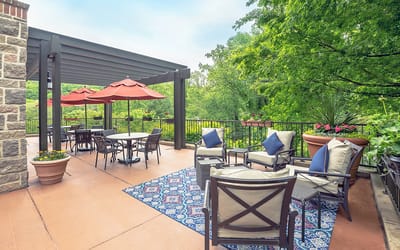 Outdoor patio with seating and umbrellas