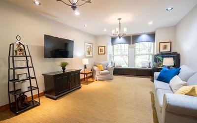 Bright common area with seating and natural light