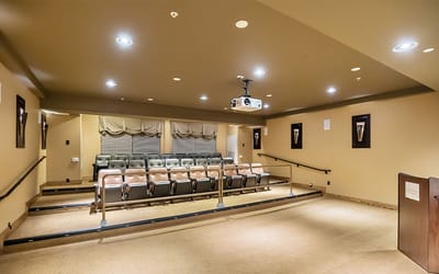 Interior view of a theater-style room with seating