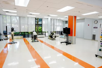 Bright interior of a therapy room with exercise equipment