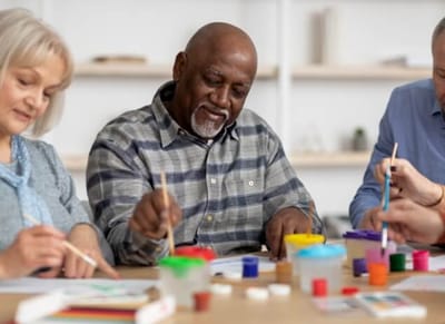 New York Center for Rehabilitation & Nursing, Nursing Home in Astoria, NY — Seniors engaging in an art activity at a table