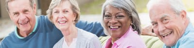 A group of smiling residents enjoying time together