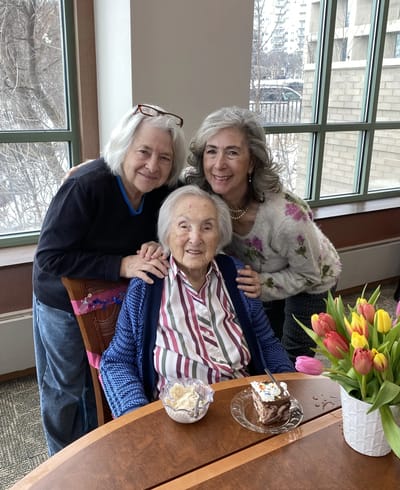 Resident celebrating with family in common area