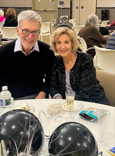 Two residents celebrating New Year's Eve at a party