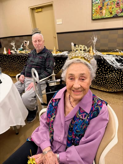 Residents celebrating New Year's Eve with crowns and decorations