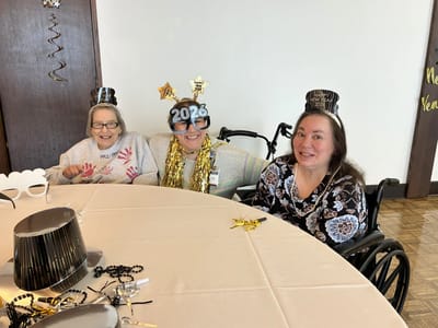Residents celebrating New Year with party hats and decorations