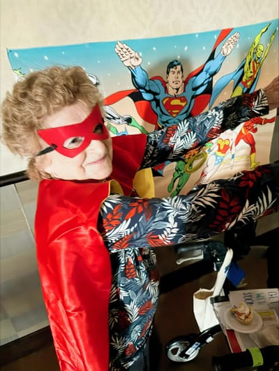 Resident dressed as a superhero during an activity