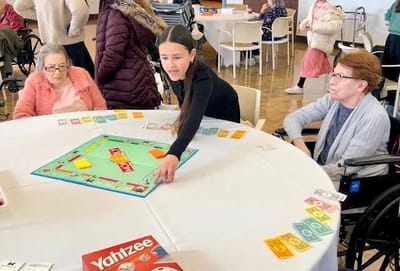 Residents enjoying a game in a common area