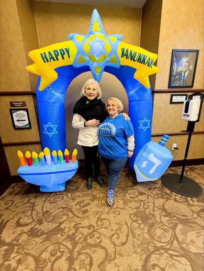 Residents and staff celebrating Hanukkah with decorations