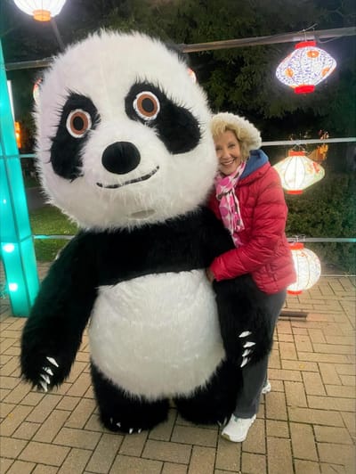 Ovation Jewish Home, Nursing Home in Milwaukee, WI — Woman posing with a large panda mascot