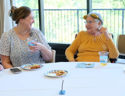Residents enjoying a meal together in a dining area