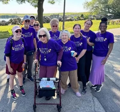 Residents and staff participating in a walk event