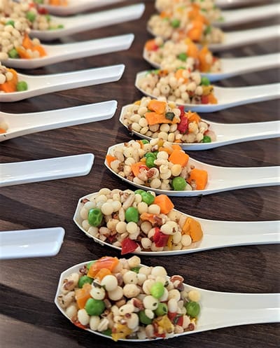 Various colorful ingredients displayed on spoons