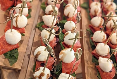Close-up of appetizers on a wooden platter