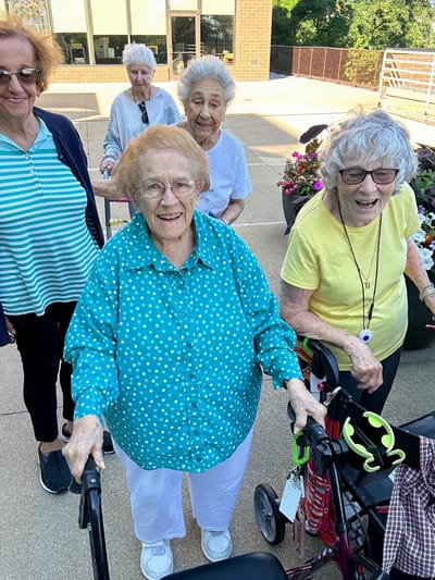 Residents enjoying time outdoors in a garden area
