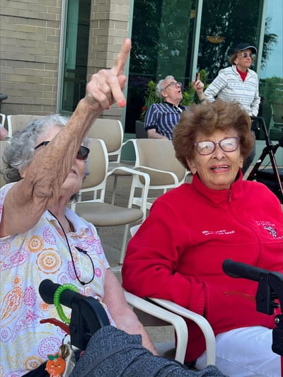 Residents enjoying time outdoors at the facility.