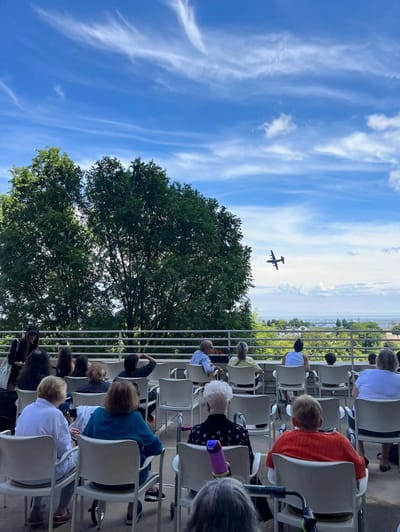 Residents enjoying an outdoor event with a view