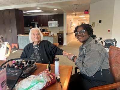 An activity of a resident receiving a manicure.