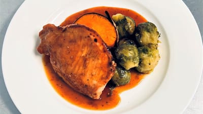 Plated meal with chicken and vegetables
