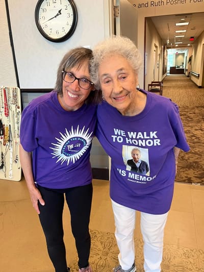 Residents smiling together in a common area.
