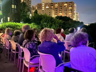 Residents enjoying an outdoor event in the evening