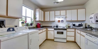 Bright interior kitchen with appliances and cabinets