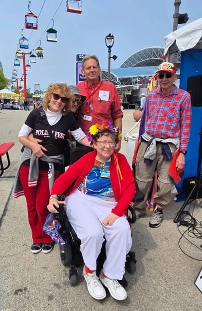 Residents and staff enjoying a festival event outdoors