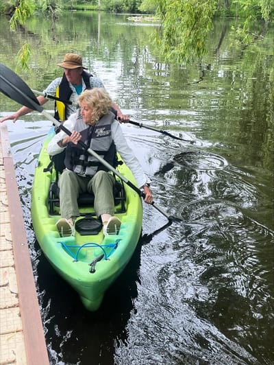 Residents kayaking on a serene lake
