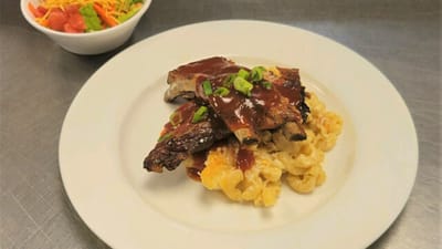 Delicious plate of ribs and mac and cheese