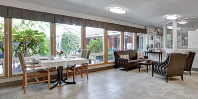 Bright common area with view of outdoor space