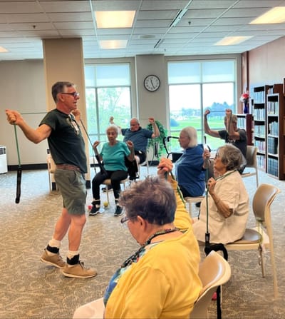 Residents participating in a light exercise class