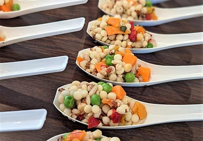 Close-up of food served in spoons for residents