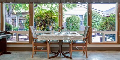 Dining area with a view of outdoor greenery
