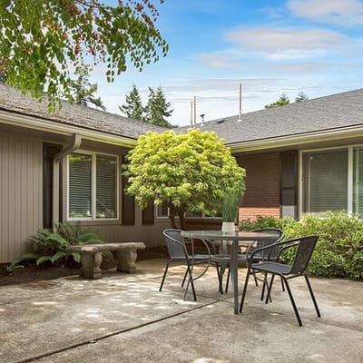 Outdoor patio area with table and chairs
