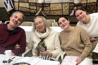 Residents and family members enjoying a meal together