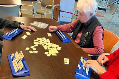 Residents playing a game in a common area