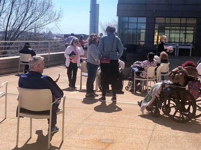 Residents enjoying an outdoor activity on a sunny day