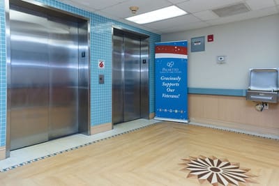 Interior view of an elevator area at Palmetto Subacute Care Center