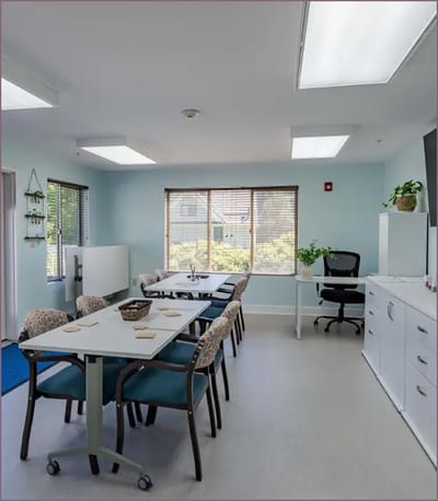Bright common area with tables and chairs