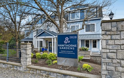 Exterior view of Hawthorne Gardens with signage