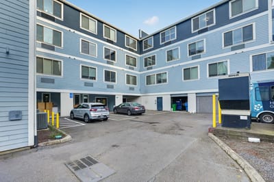 Exterior view of a nursing home building with parking.