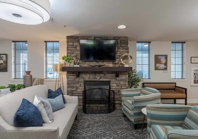 Cozy common area with fireplace and seating.