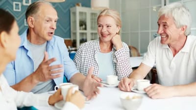 Seniors engaging in conversation over coffee