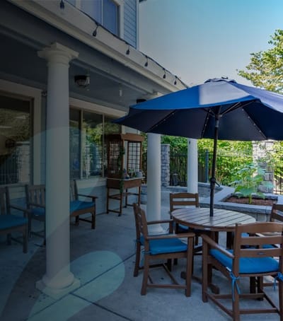 Outdoor seating area with umbrellas and tables.