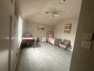 A well-furnished resident room with two beds