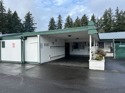 Exterior view of building entrance with covered area