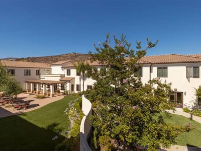 View of landscaped garden area in a senior living facility