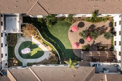 Aerial view of a well-maintained outdoor space with lounge areas