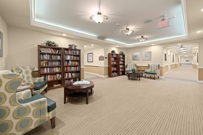 Bright and inviting common area with bookshelves